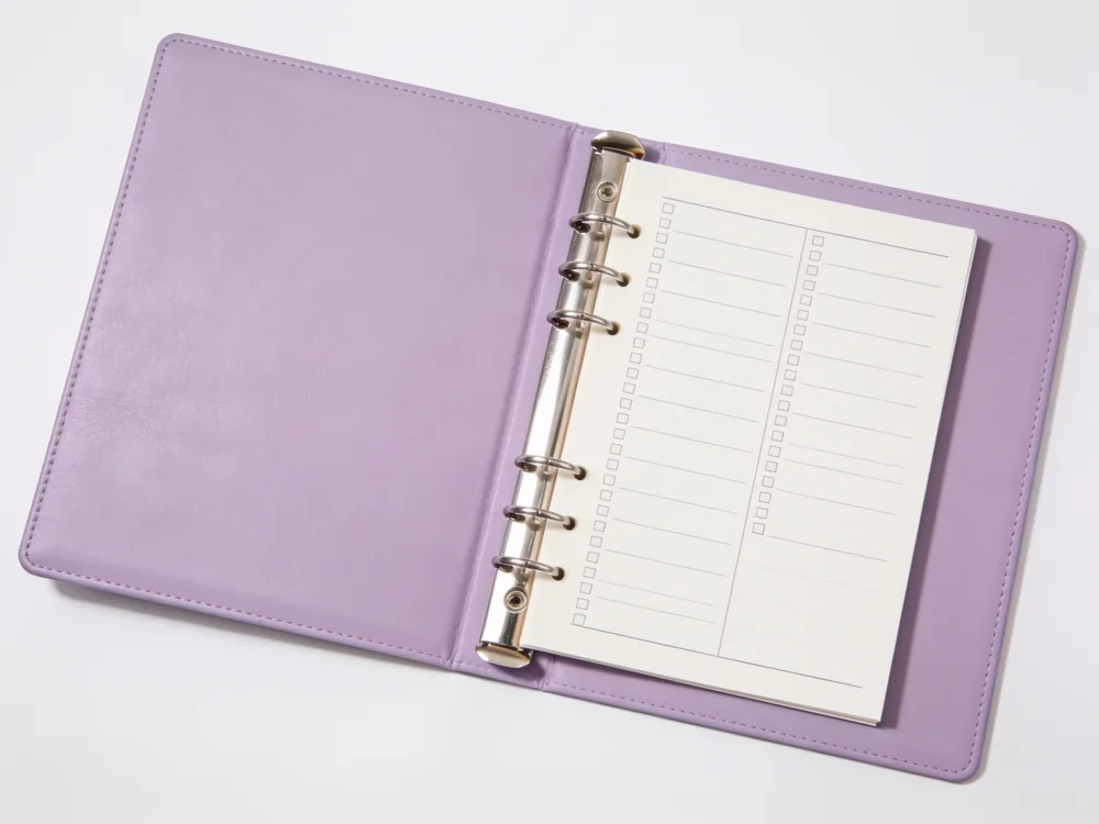 Ring-binder routine planner — Paper inserts; six-ring metal binder; PU cover