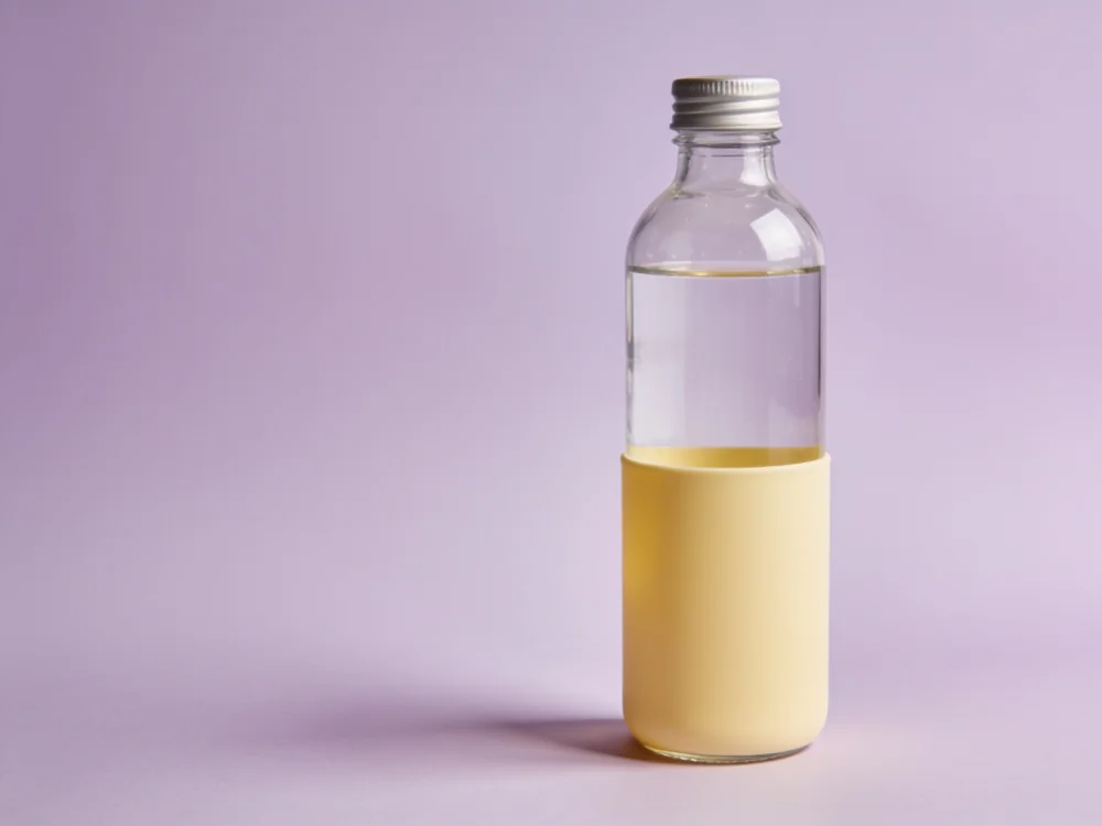 Glass sleeve bottle — Glass body; removable silicone sleeve; polypropylene cap